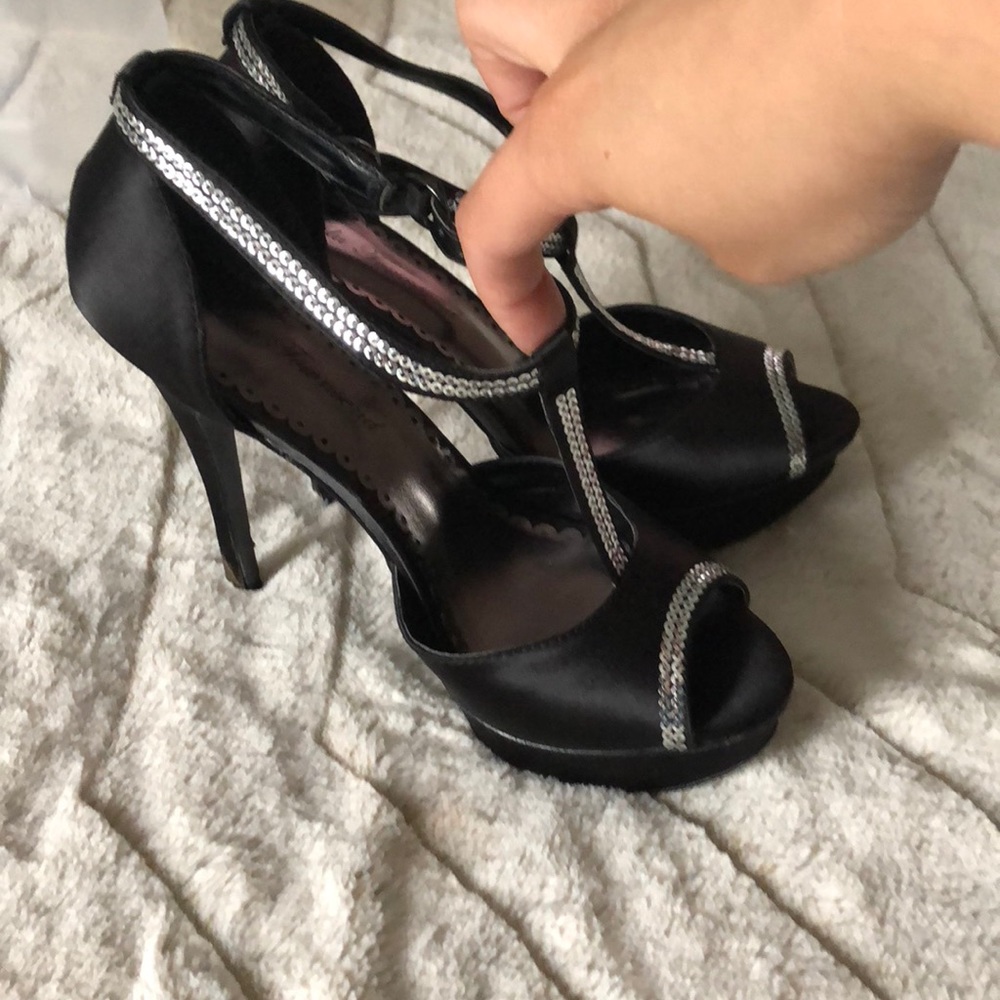 Black open toe heels with silver accent.